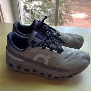 On Running Gray and Purple Athletic Shoes with Cloud Cushioning